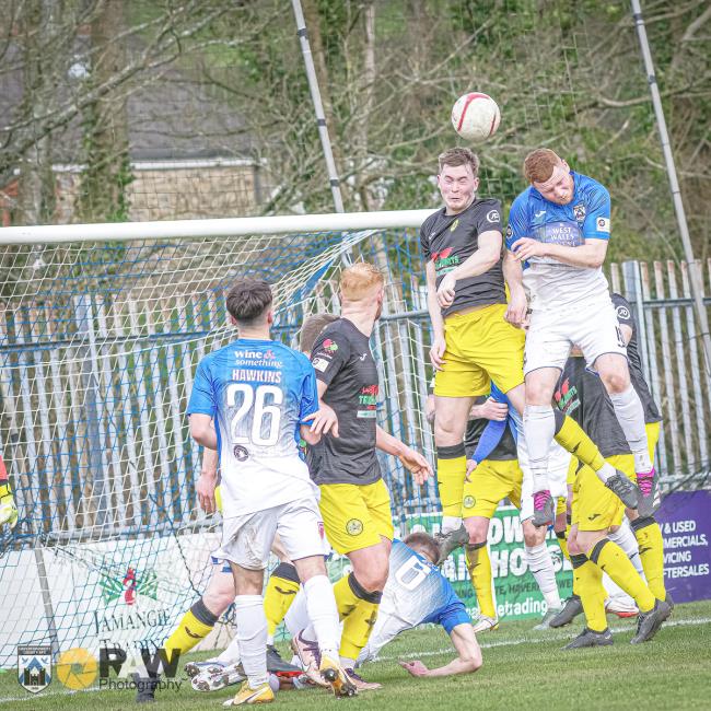 Lee Jenkins wins this aerial battle for the Bluebirds